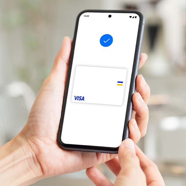 A smartphone with Visa card in the payment app
